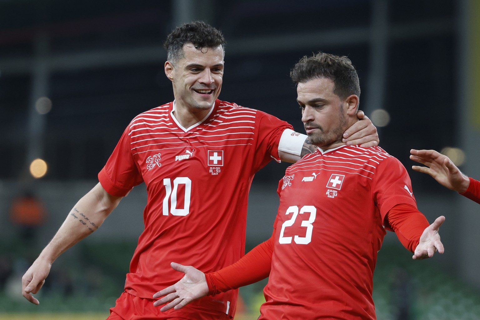 Switzerland&#039;s Xherdan Shaqiri, right, celebrates with teammate Granit Xhaka after scoring to 0:1 during the international friendly soccer match between Ireland and Switzerland at the Aviva Stadiu ...