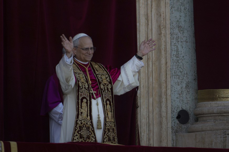 Newly elected Pope Leo XIV, formerly Cardinal Robert Francis Prevost, appears on the central loggia of St. Peter&#039;s Basilica at the Vatican shortly after his election as the 267th pontiff of the R ...