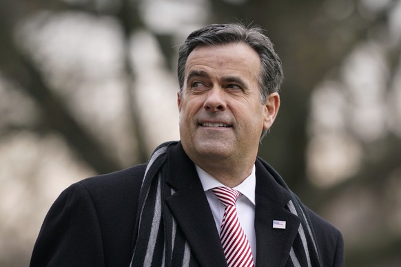 FILE - Director of National Intelligence John Ratcliffe waits to board Marine One with President Donald Trump on the South Lawn of the White House in Washington, Dec. 12, 2020. (AP Photo/Patrick Seman ...
