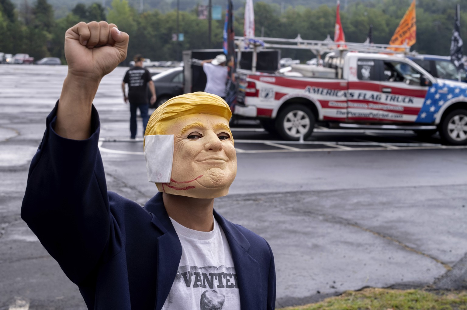 &quot;Breakdancer for Trump&quot; Victor Moon poses in a Donald Trump mask before campaign rally for Republican presidential nominee former President Trump at the Mohegan Sun Arena at Casey Plaza in W ...