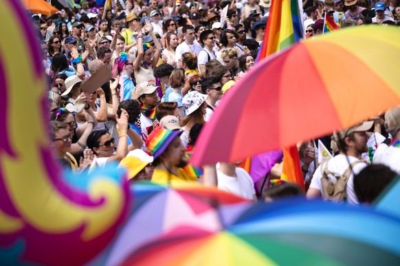 People take part in the Zurich Pride parade in Zurich, Switzerland, on Saturday, June 17, 2023. (KEYSTONE/Michael Buholzer)